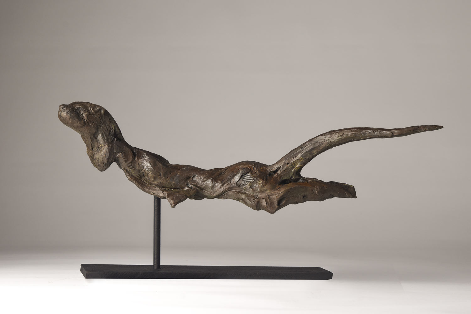 Swimming Otter sculpture in bronze